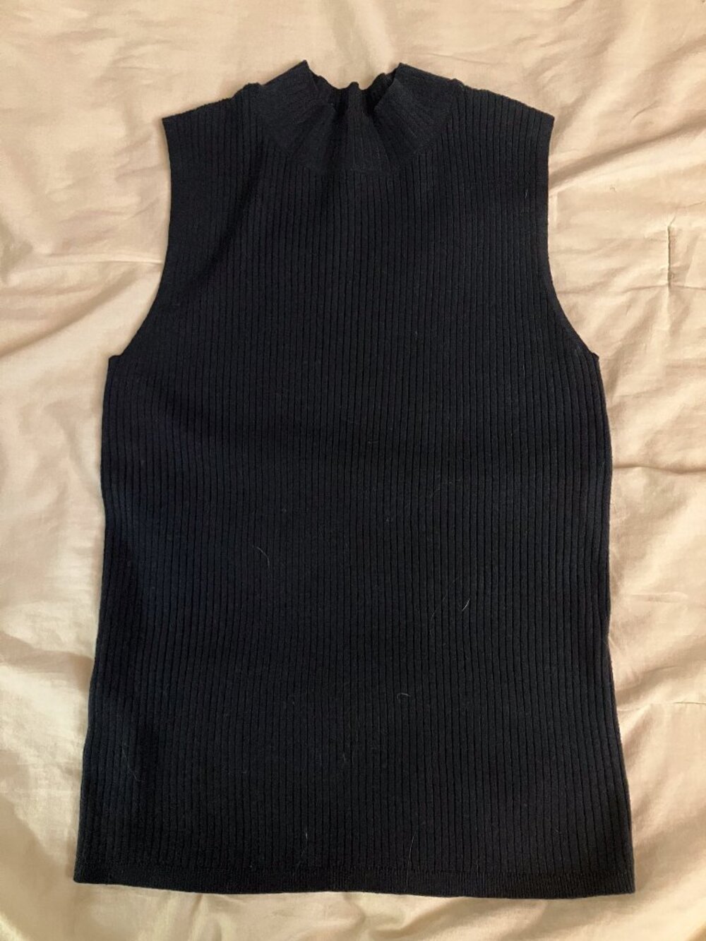 Perfect for fall layering! Navy ribbed sleeveless mock turtleneck
